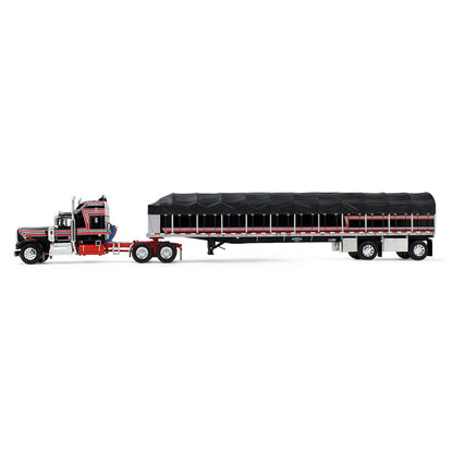 A die-cast model of a classic Kenworth semi-truck with a black and red cab, towing a long black canvas-covered trailer, shown on a plain white background.