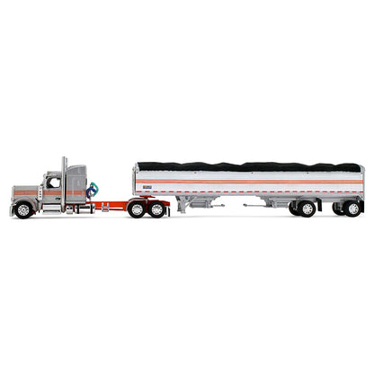 A diecast model of a Peterbilt semi-truck pulling a white grain trailer with orange stripes and a black tarp, on a white background.