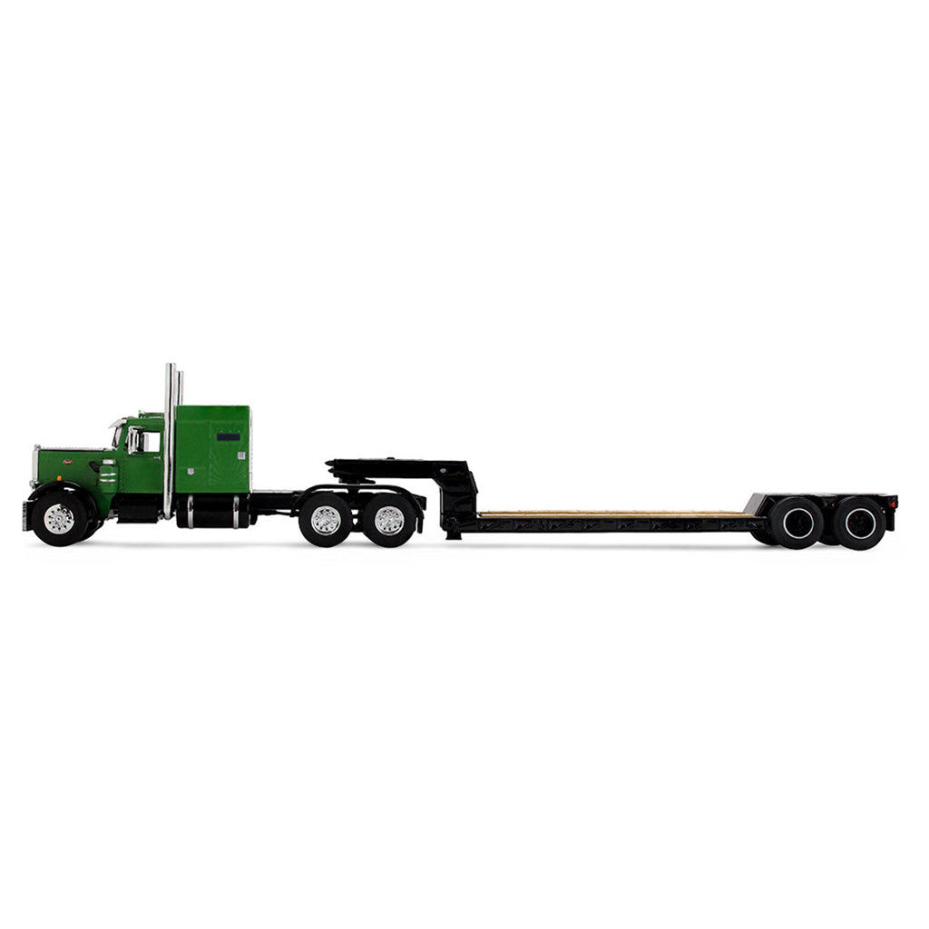 Model of a green and black truck with a lowboy trailer on a white background