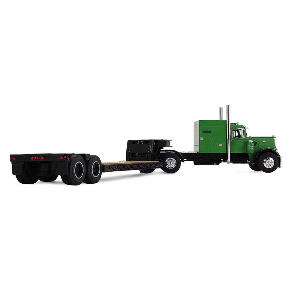 Model of a green and black truck with a lowboy trailer on a white background