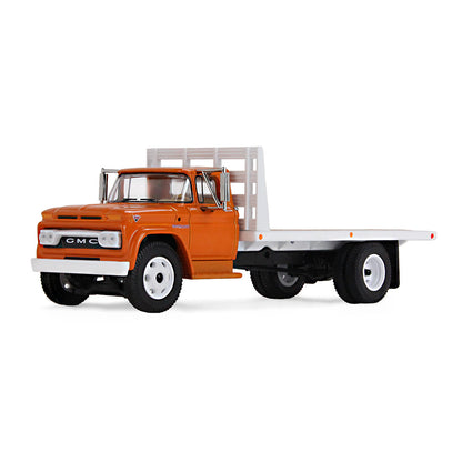 An orange GMC flatbed truck model with a white flatbed and white wheels, shown on a clean white background.