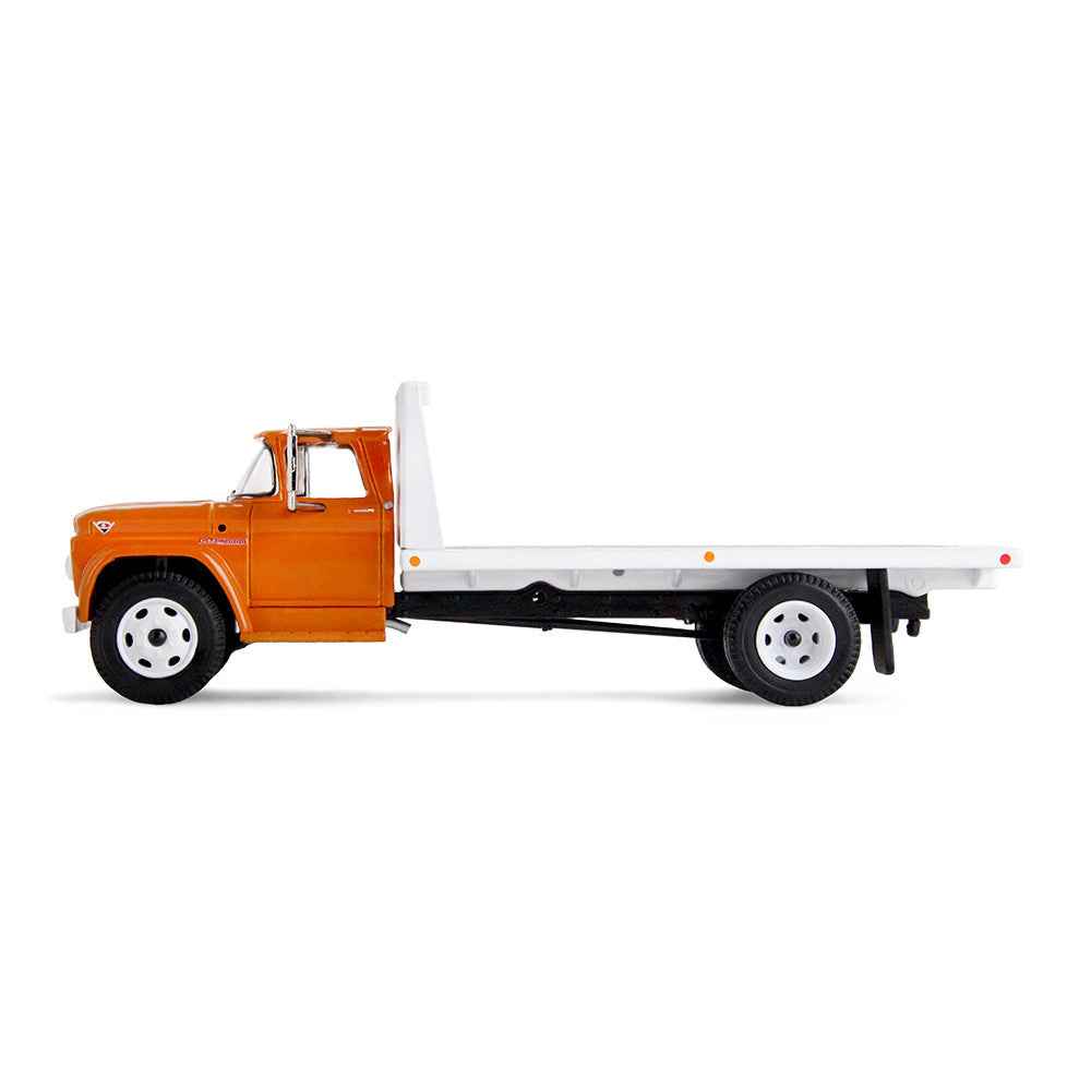An orange GMC flatbed truck model with a white flatbed and white wheels, shown on a clean white background.