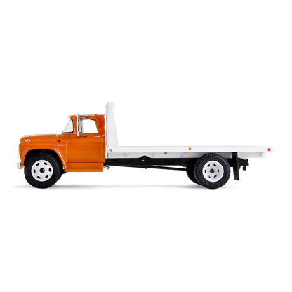 An orange GMC flatbed truck model with a white flatbed and white wheels, shown on a clean white background.