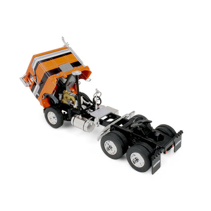 Model truck with an orange cab on a white background
