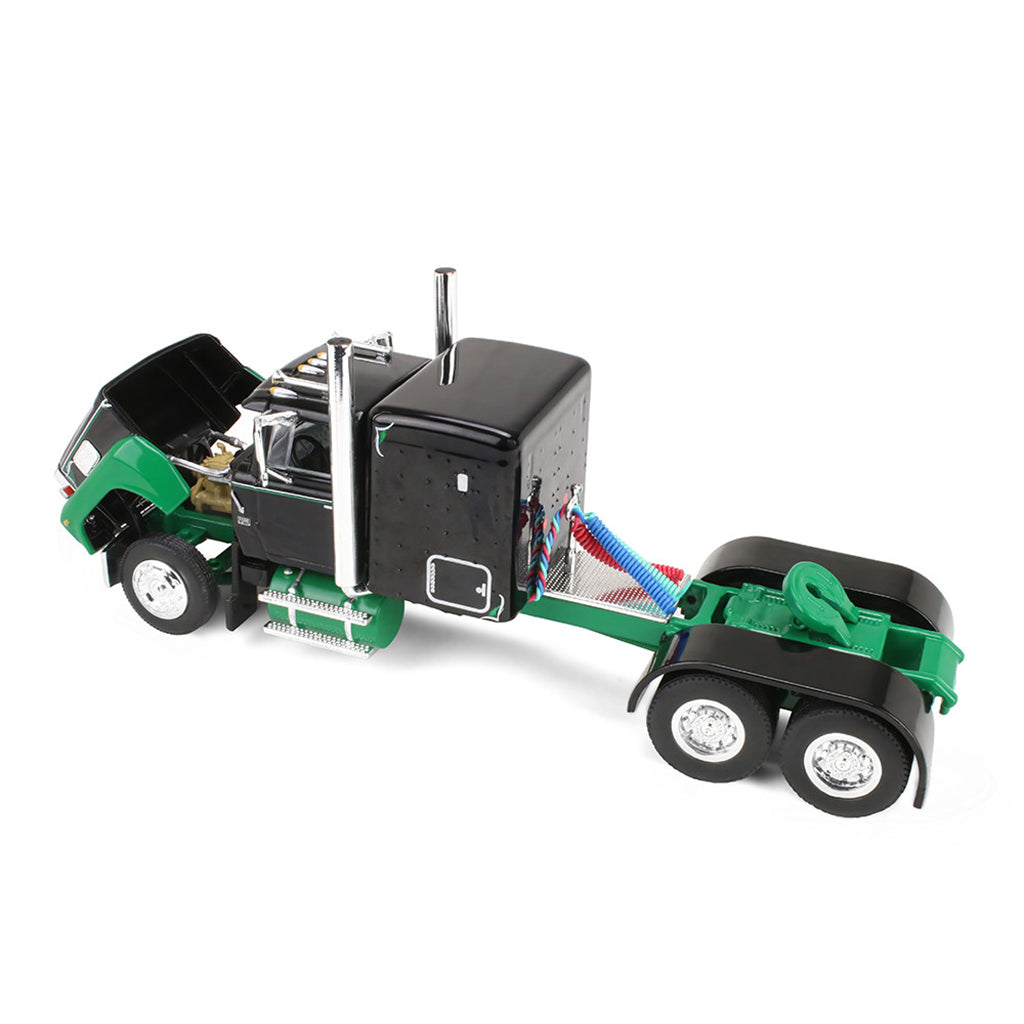 A semi-truck model with a black cab and green chassis shown on a plain white background.
