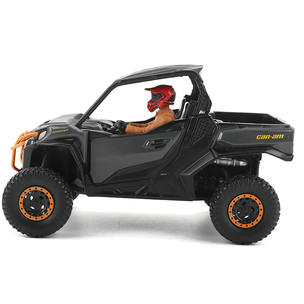 Black Can-Am vehicle with a person wearing a red helmet inside on a white background