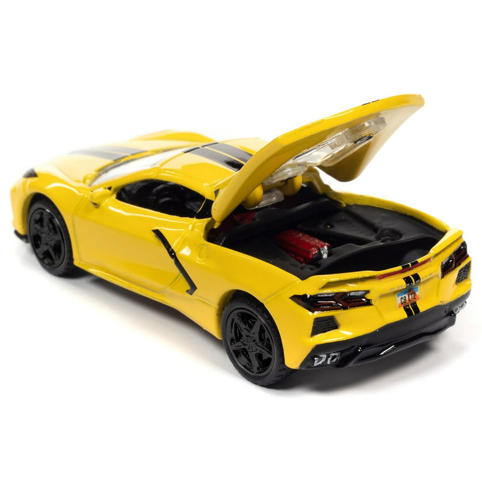 Yellow model car with open hood on a white background