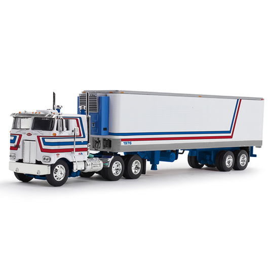A die-cast model of a classic semi-truck with a white refrigerated trailer, featuring red and blue stripes, on a clean white background.