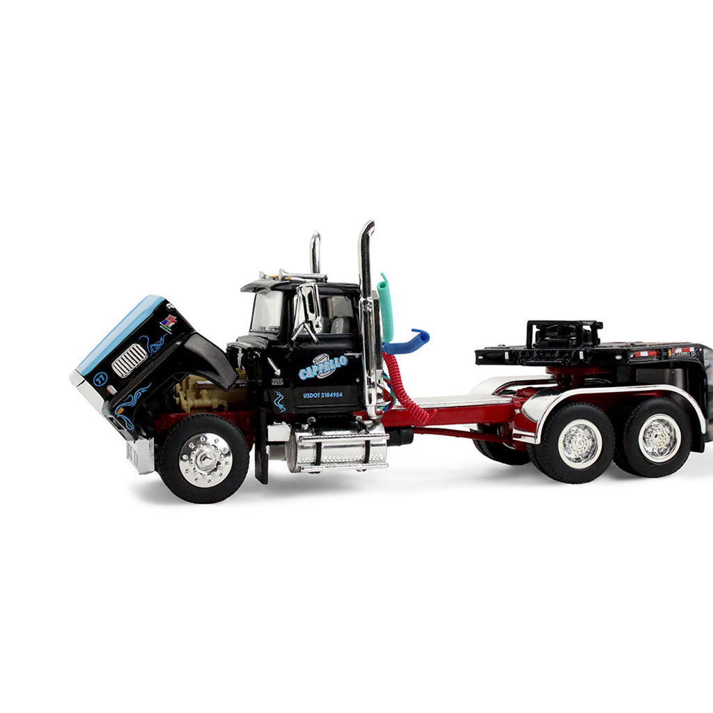 Model truck with a tow truck attachment on a white background