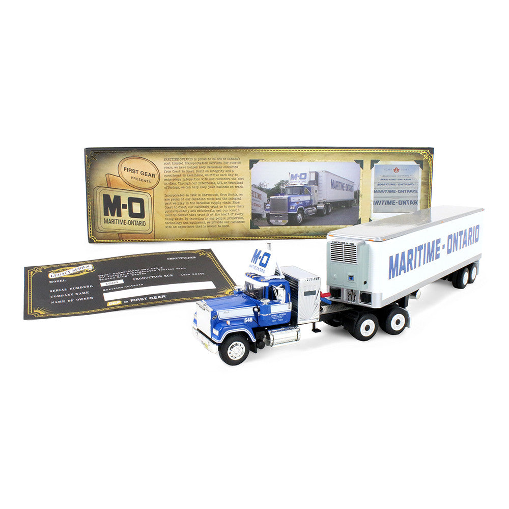 M-O Maritime Series die-cast model truck with a blue cab and white refrigerated trailer, shown with its retail box and instruction booklet on a white background.