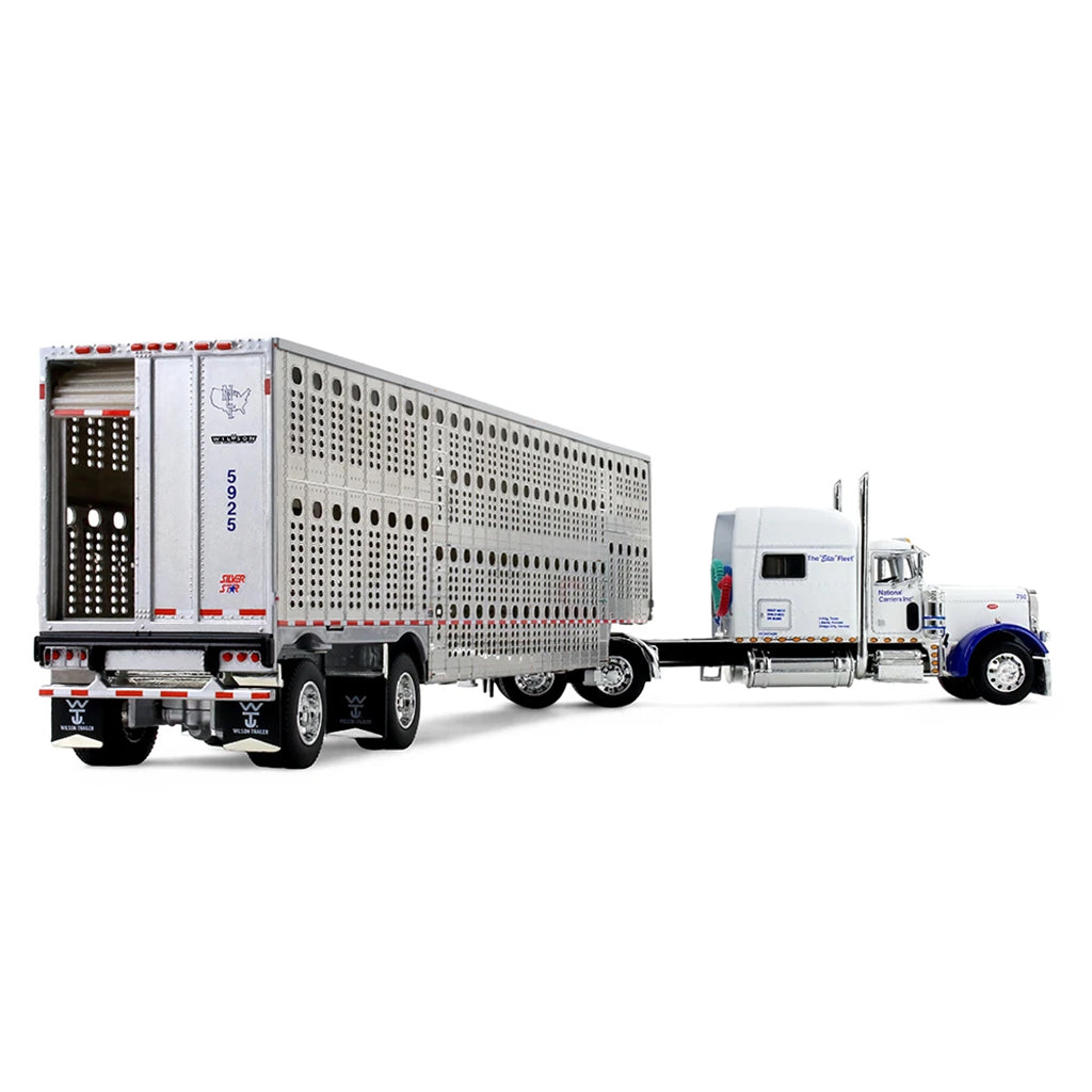 A diecast model of a Peterbilt semi-truck with a silver livestock carrier trailer, featuring blue accents on the cab and 'National Carriers' branding on the trailer, set against a plain white background.