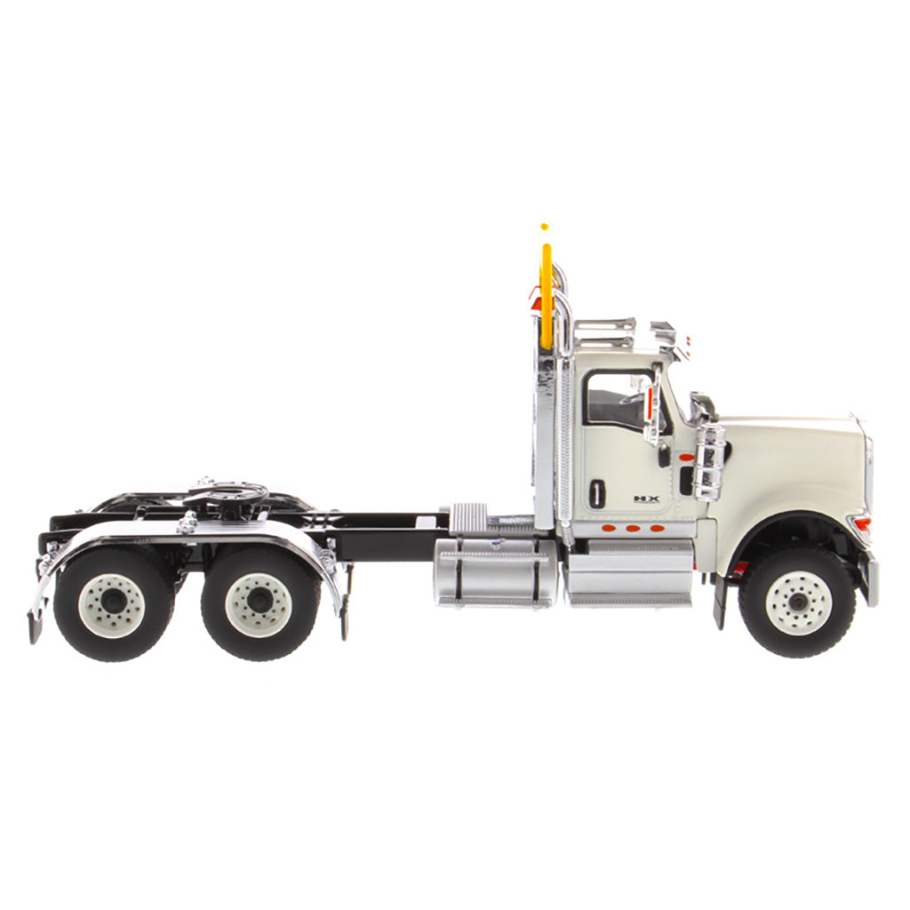 1:50 Scale Diecast Model of a White International HX520 Tandem-Axle Day Cab Tractor on a White Background