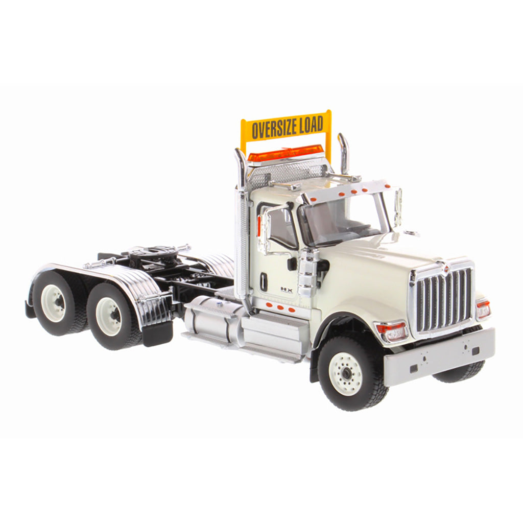 1:50 Scale Diecast Model of a White International HX520 Tandem-Axle Day Cab Tractor on a White Background