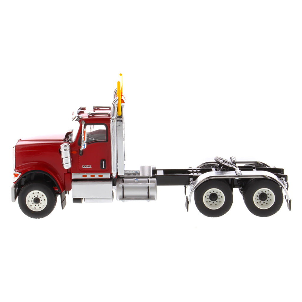 1:50 Scale Diecast Model of a Red International HX520 Tandem-Axle Day Cab Tractor on a White Background