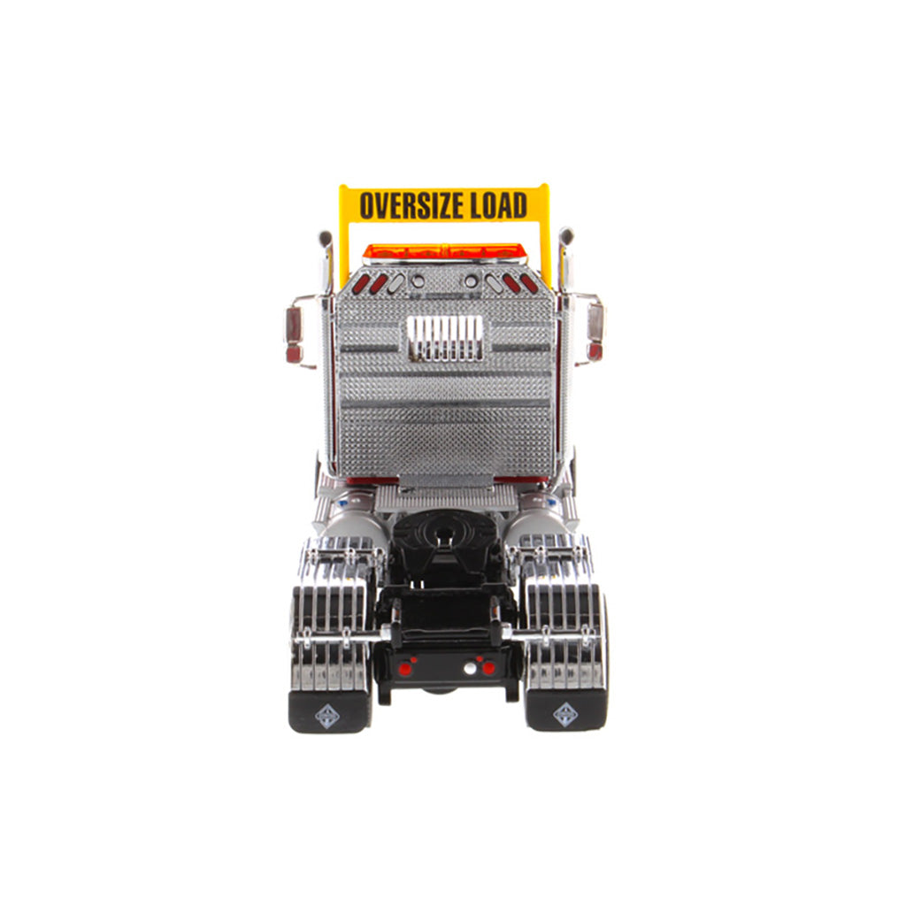 1:50 Scale Diecast Model of a Red International HX520 Tandem-Axle Day Cab Tractor on a White Background