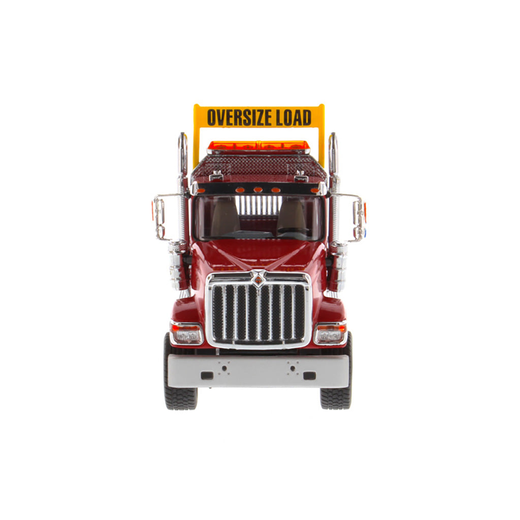 1:50 Scale Diecast Model of a Red International HX520 Tandem-Axle Day Cab Tractor on a White Background