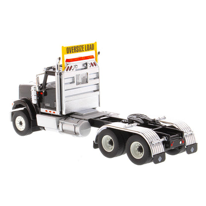 1:50 Scale Diecast Model of a Black International HX520 Tandem-Axle Day Cab Tractor on a White Background