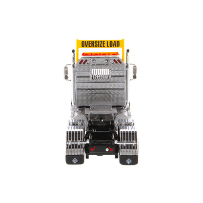 1:50 Scale Diecast Model of a Black International HX520 Tandem-Axle Day Cab Tractor on a White Background