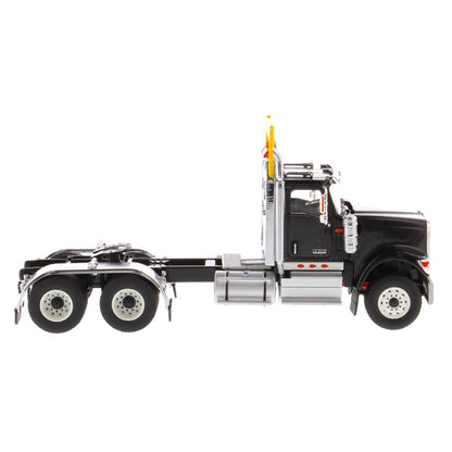 1:50 Scale Diecast Model of a Black International HX520 Tandem-Axle Day Cab Tractor on a White Background