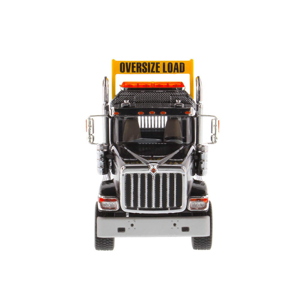 1:50 Scale Diecast Model of a Black International HX520 Tandem-Axle Day Cab Tractor on a White Background