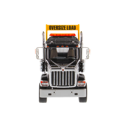 1:50 Scale Diecast Model of a Black International HX520 Tandem-Axle Day Cab Tractor on a White Background
