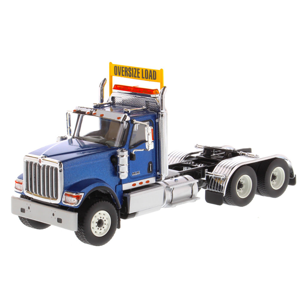 1:50 Scale Diecast Model of a Blue International HX520 Tandem-Axle Day Cab Tractor on a White Background