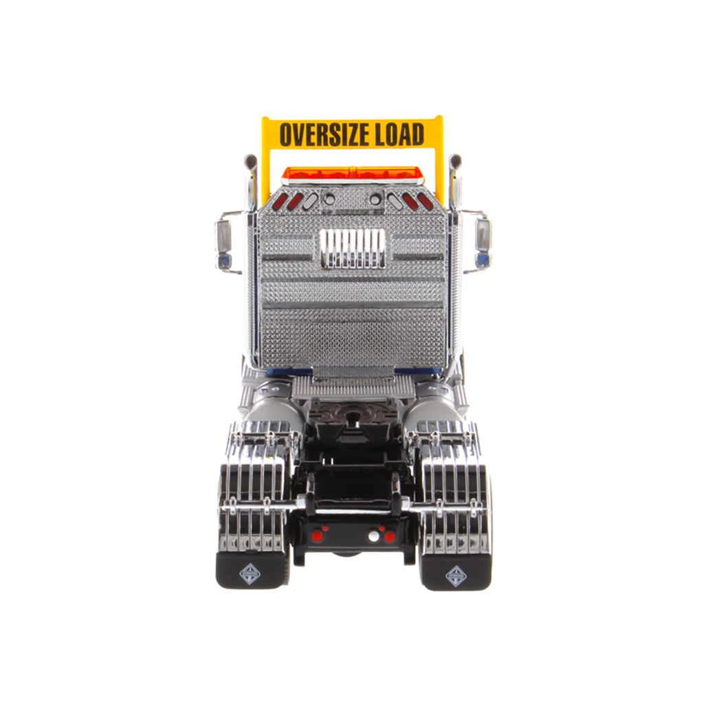 1:50 Scale Diecast Model of a Blue International HX520 Tandem-Axle Day Cab Tractor on a White Background