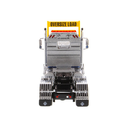 1:50 Scale Diecast Model of a Blue International HX520 Tandem-Axle Day Cab Tractor on a White Background