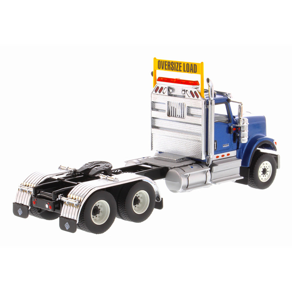 1:50 Scale Diecast Model of a Blue International HX520 Tandem-Axle Day Cab Tractor on a White Background