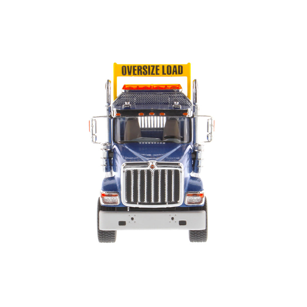 1:50 Scale Diecast Model of a Blue International HX520 Tandem-Axle Day Cab Tractor on a White Background