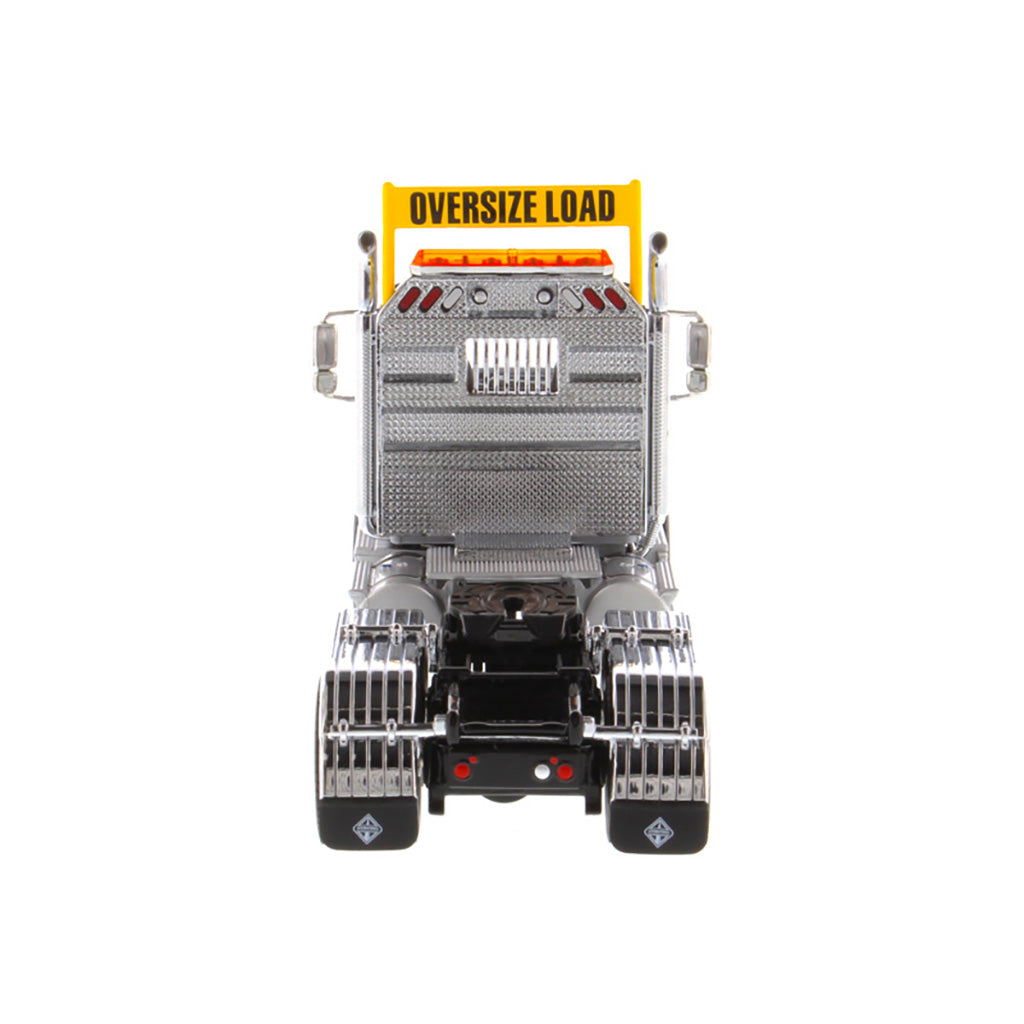 1:50 Scale Diecast Model of a Light Gray International HX520 Tandem-Axle Day Cab Tractor on a White Background