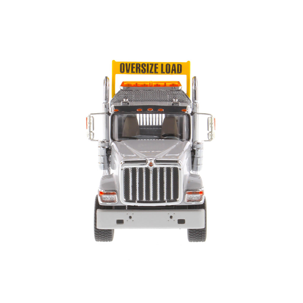 1:50 Scale Diecast Model of a Light Gray International HX520 Tandem-Axle Day Cab Tractor on a White Background