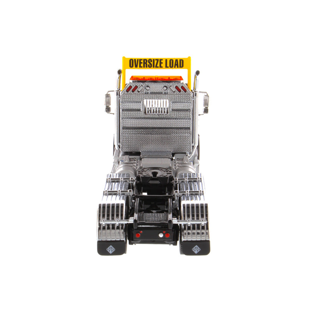 1:50 Scale Diecast Model of a Metallic Black International HX620 Tri-Axle Day Cab Tractor on a White Background