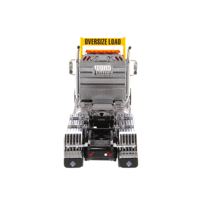 1:50 Scale Diecast Model of a Metallic Black International HX620 Tri-Axle Day Cab Tractor on a White Background