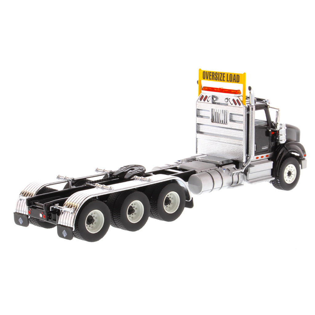 1:50 Scale Diecast Model of a Metallic Black International HX620 Tri-Axle Day Cab Tractor on a White Background