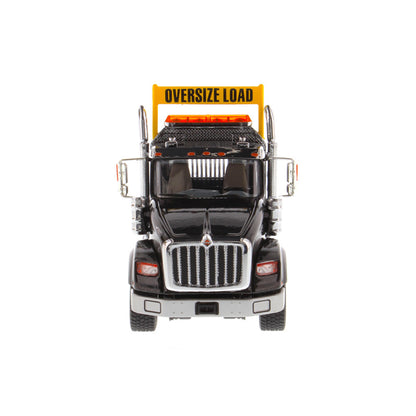 1:50 Scale Diecast Model of a Metallic Black International HX620 Tri-Axle Day Cab Tractor on a White Background