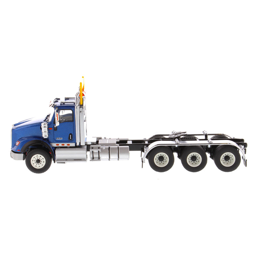 1:50 Scale Diecast Model of a Metallic Blue International HX620 Tri-Axle Day Cab Tractor on a White Background