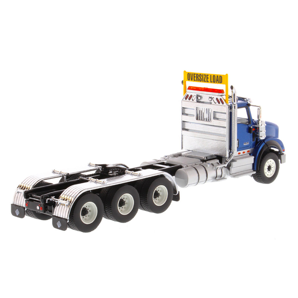 1:50 Scale Diecast Model of a Metallic Blue International HX620 Tri-Axle Day Cab Tractor on a White Background