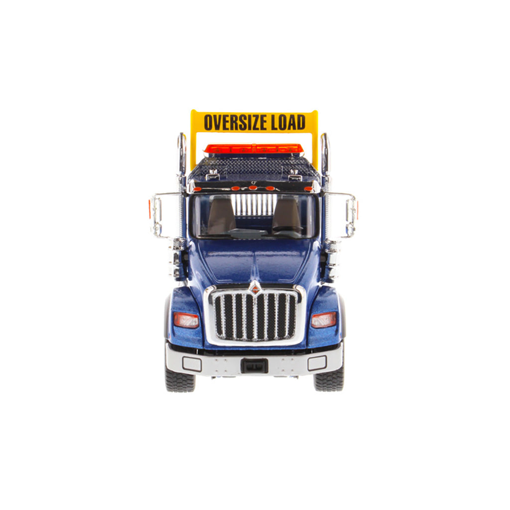1:50 Scale Diecast Model of a Metallic Blue International HX620 Tri-Axle Day Cab Tractor on a White Background