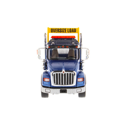 1:50 Scale Diecast Model of a Metallic Blue International HX620 Tri-Axle Day Cab Tractor on a White Background