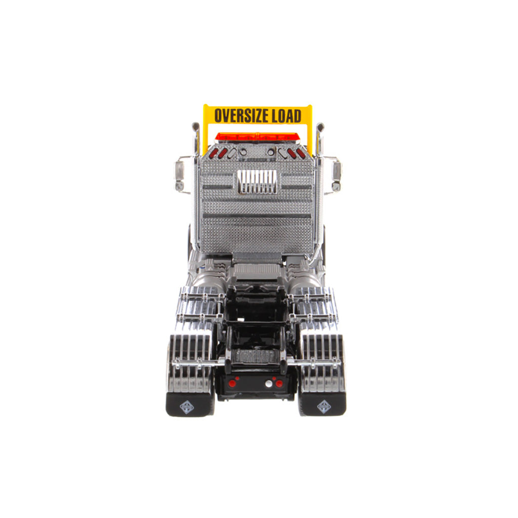 1:50 Scale Diecast Model of a Light Gray International HX620 Tri-Axle Day Cab Tractor on a White Background