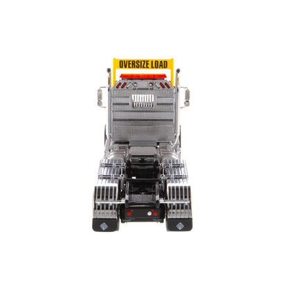 1:50 Scale Diecast Model of a Light Gray International HX620 Tri-Axle Day Cab Tractor on a White Background
