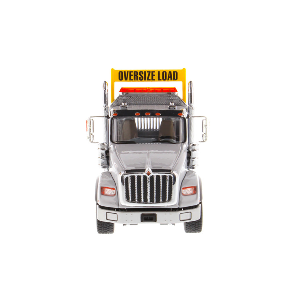 1:50 Scale Diecast Model of a Light Gray International HX620 Tri-Axle Day Cab Tractor on a White Background