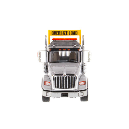 1:50 Scale Diecast Model of a Light Gray International HX620 Tri-Axle Day Cab Tractor on a White Background