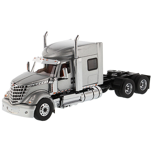 Model of a Silver International LoneStar Mid-Roof Sleeper Tractor on a White Background