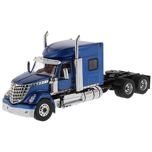 Model of a Blue International LoneStar Mid-Roof Sleeper Tractor on a White Background