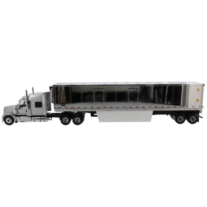 Model of a Silver International LoneStar Tandem Axle Mid-Roof Sleeper Tractor pulling a chrome plated 53' Refrigerated Freight Van Trailer on a white background