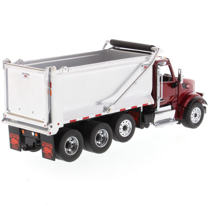 1:50th Scale Diecast Model of a Red & Silver Peterbilt Model 567 Dump Truck on a White Background