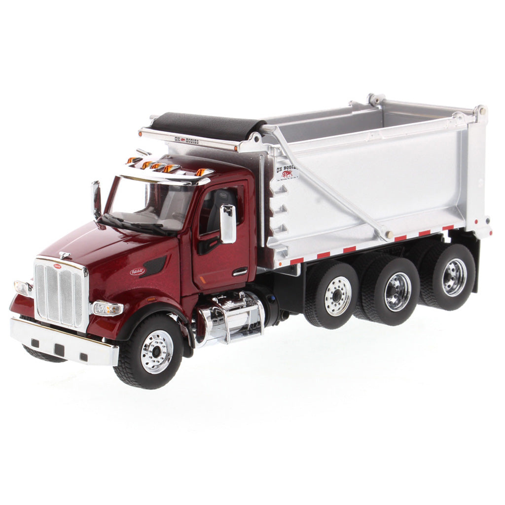 1:50th Scale Diecast Model of a Red & Silver Peterbilt Model 567 Dump Truck on a White Background