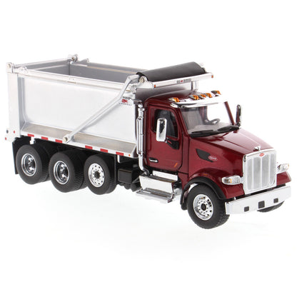 1:50th Scale Diecast Model of a Red & Silver Peterbilt Model 567 Dump Truck on a White Background